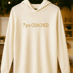 White hoodie with "got COACHED" text.