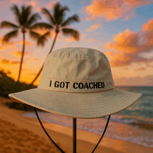 Bucket hat on beach at sunset.